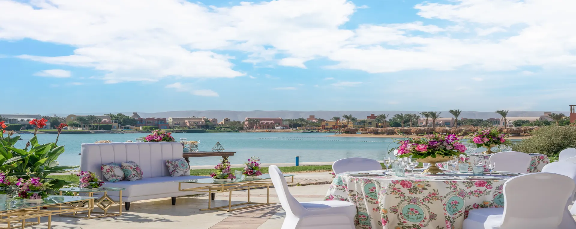 Dining area overlooking the lagoon, featuring elegantly set tables and comfortable seating. Large windows or an open terrace provide an unobstructed view of the tranquil lagoon waters, creating a serene and picturesque dining experience.
