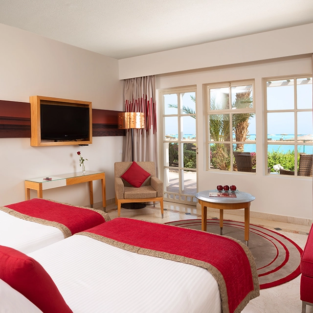 Twin bed with curtains open at Mövenpick.