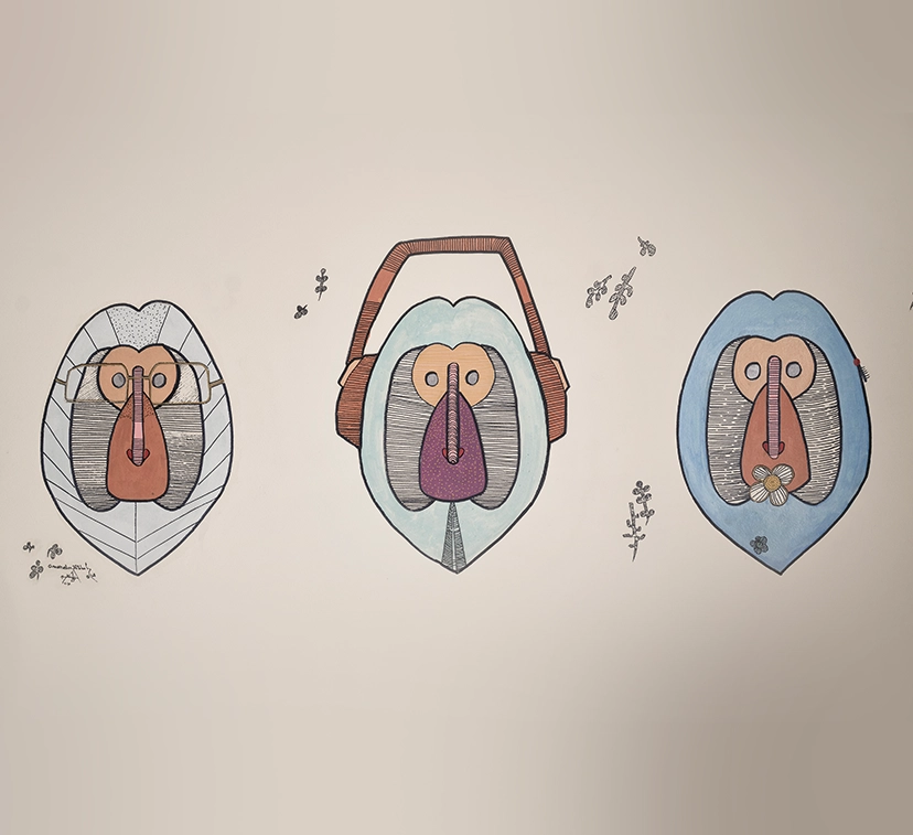 A collection of local art pieces displayed in a gallery setting in El Gouna. The artwork includes vibrant paintings and handcrafted items that reflect the local culture and landscape. The display is arranged on white walls with proper lighting to highlight the colors and details of each piece.