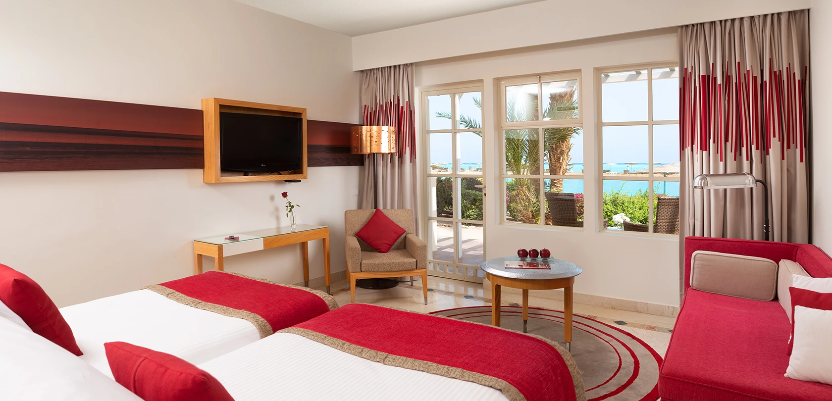 Twin bed with curtains open in a cozy hotel room, inviting guests to relax after a long day of exploring.