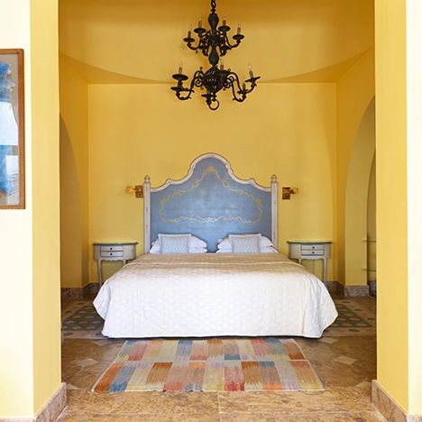 Interior of a classic hotel room at La Maison Bleue El Gouna, showcasing timeless decor and elegant ambiance.