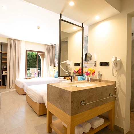 Comfort Room at The Three Corners Rihana Resort. The room features elegant furnishings and a cozy atmosphere, showcasing a well-designed and inviting space.