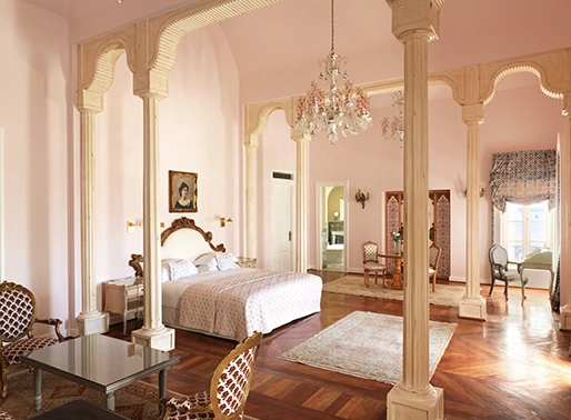 A view from a room at La Maison Bleue, showcasing the surrounding scenery. The view may include lush gardens, a swimming pool, or the picturesque landscape of El Gouna. The room's windows or balcony offer a glimpse of the resort's beautiful environment, with natural light highlighting the tranquility and elegance of the setting.