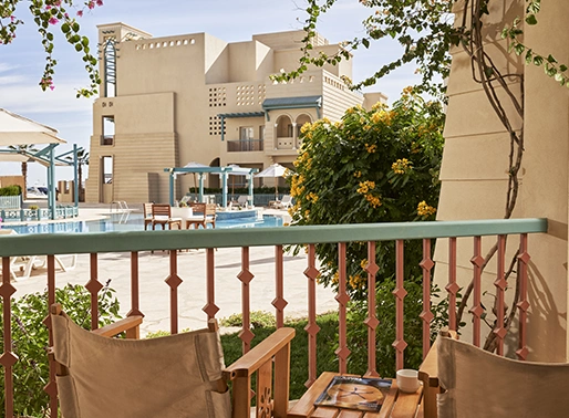 Poolside terrace at Mosaique Hotel El Gouna, offering comfortable seating and views of the pool.