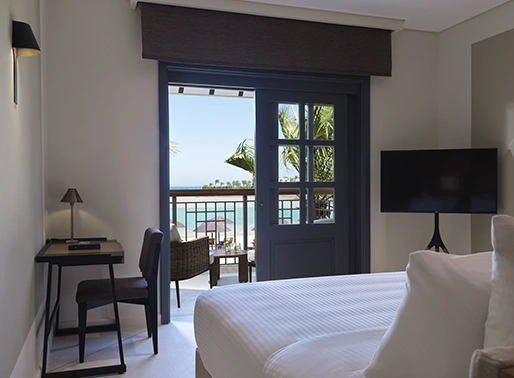 The Chedi El Gouna Red Sea Beach Front King room, featuring a luxurious king-size bed and stylish decor.
