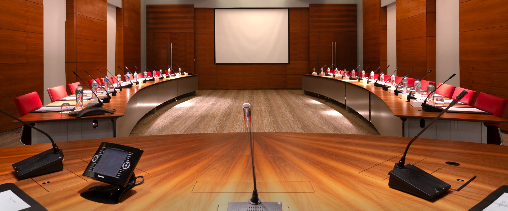 Meeting Room at Chedi El Gouna, featuring a modern setup with conference table, chairs, and presentation equipment.