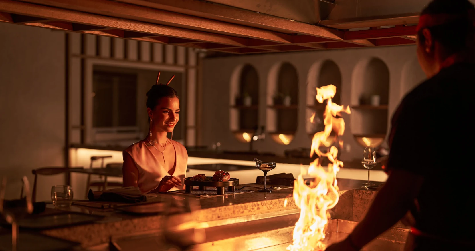 Woman Enjoying Live Cooking Show in Harumaki Restaurant
